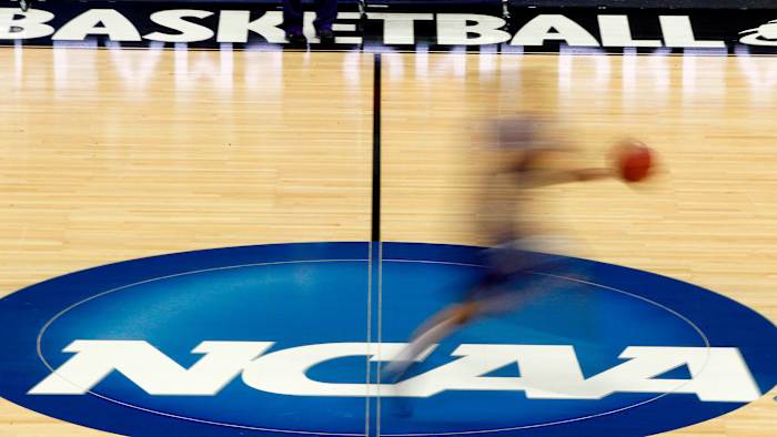 NCAA logo on a basketball court